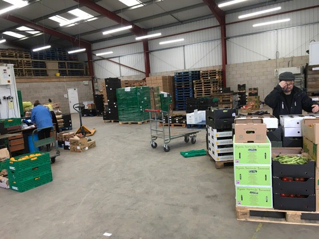 Crates of fruit and vegetables at an organic wholesalers