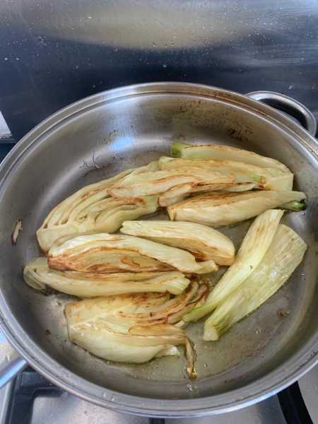 Browning fennel in a frying pan